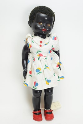 Lot 1067 - Pedigree, England: a hard plastic black walking and talking doll.