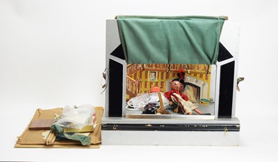 Lot 1131 - Tri-ang, England: a toy theatre, two Pelham puppets; and cardboard sets and accessories.