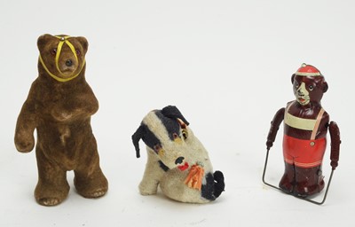 Lot 1141 - A mid 20th C German clockwork dancing bear; and clockwork skipping bear; and a dog.