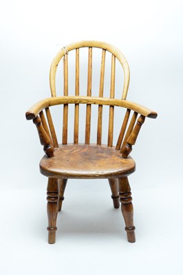 Lot 1150 - A child's elm and yew wood Windsor chair.