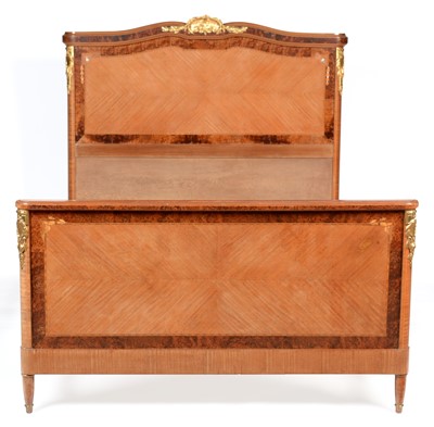 Lot 668 - Louis XVI style inlaid mahogany and amboyna double bed.