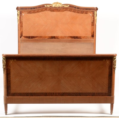 Lot 80 - Louis XVI style inlaid mahogany and amboyna double bed.