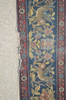 Lot 633 - An antique Kirman rug.