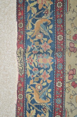 Lot 633 - An antique Kirman rug.