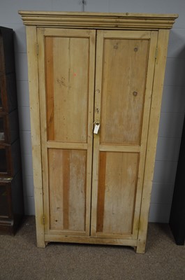 Lot 549 - A stripped pine cupboard.
