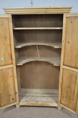 Lot 549 - A stripped pine cupboard.