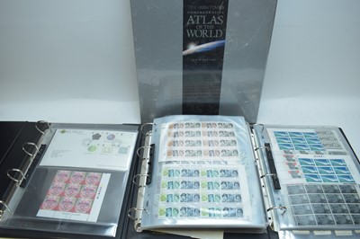 Lot 323 - Albums of stamps and cigarette cards; and a Times Atlas of the World.