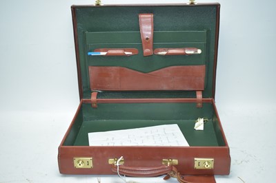 Lot 383 - Red leather briefcase.