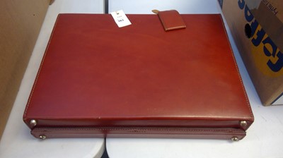 Lot 383 - Red leather briefcase.