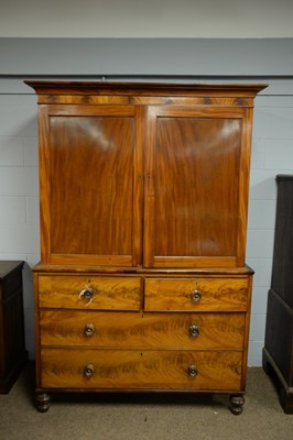 Lot 220 - A mid 19th C mahogany cabinet on chest.