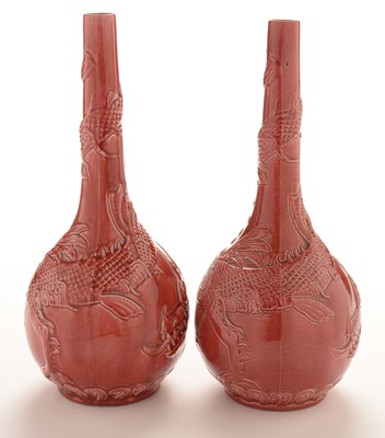 Lot 524 - Pair of Burmantofts art pottery bottle vases