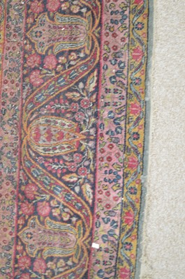 Lot 621 - A Kirman carpet.