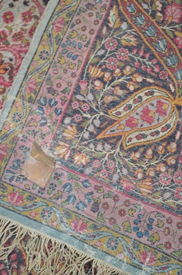 Lot 621 - A Kirman carpet.