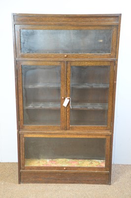 Lot 117 - An early 20th Century oak sectional bookcase in the Globe Wernicke style.