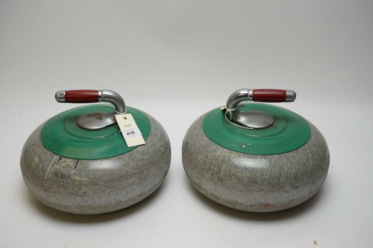 Lot 418 - A pair of curling stones