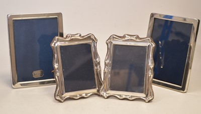 Lot 17 - Two pairs of silver mounted photograph frames