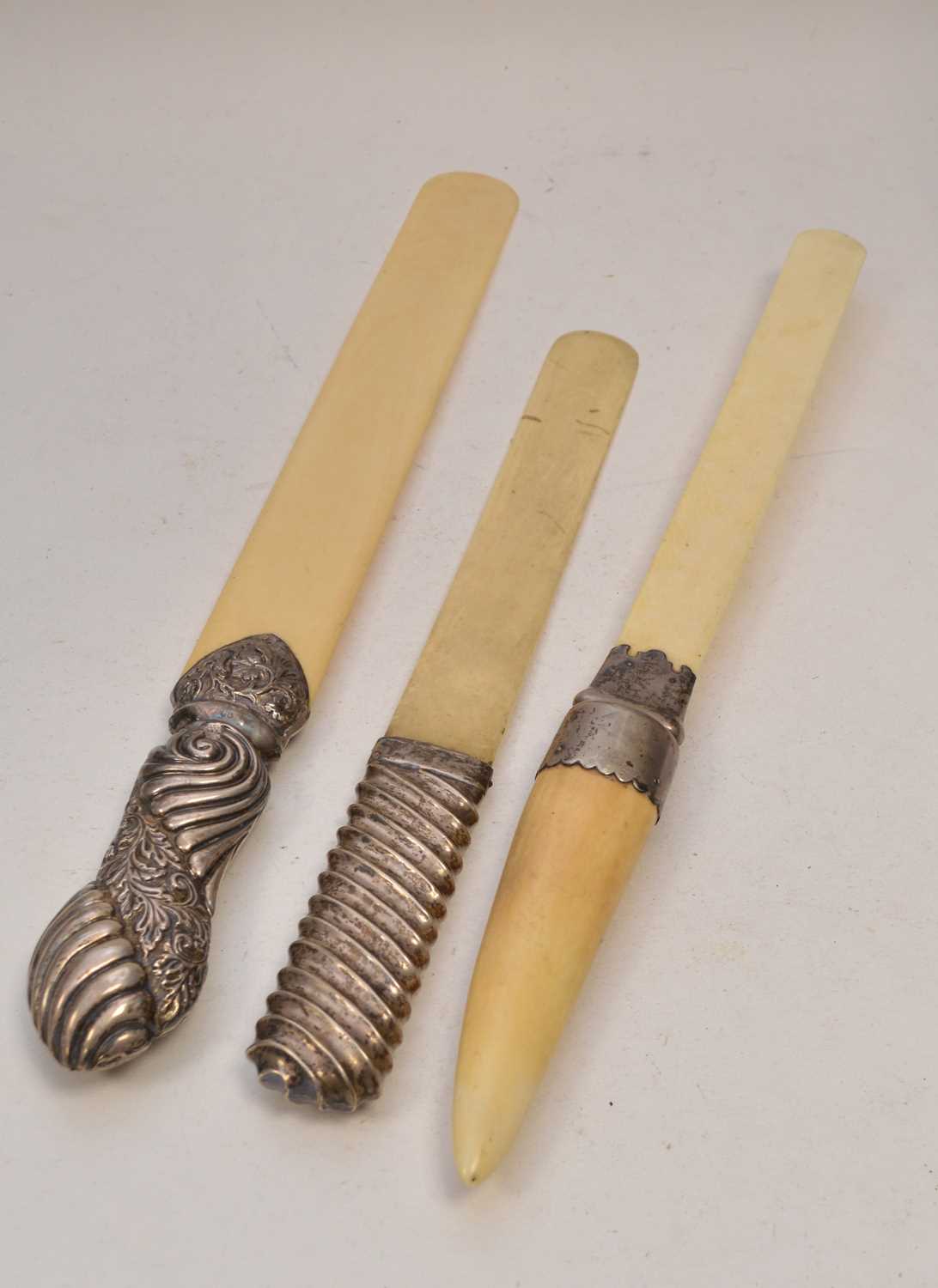 Lot 43 - Three silver mounted ivory page turners