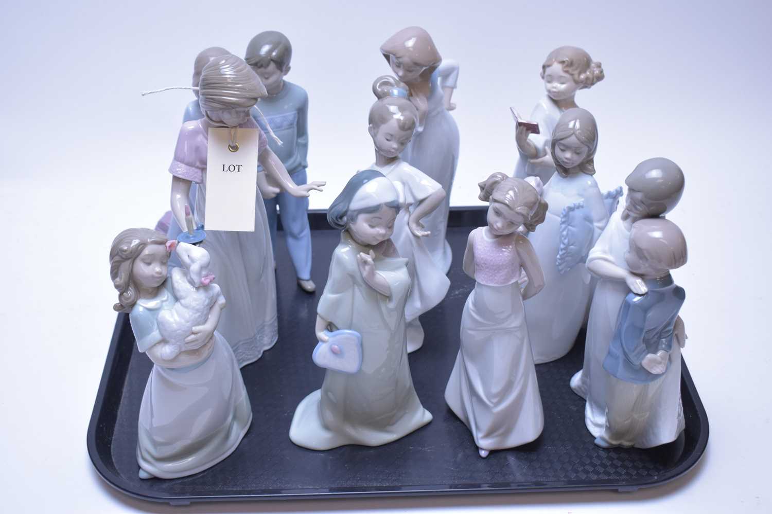 Lot 212 - Ten assorted Nao figurines.