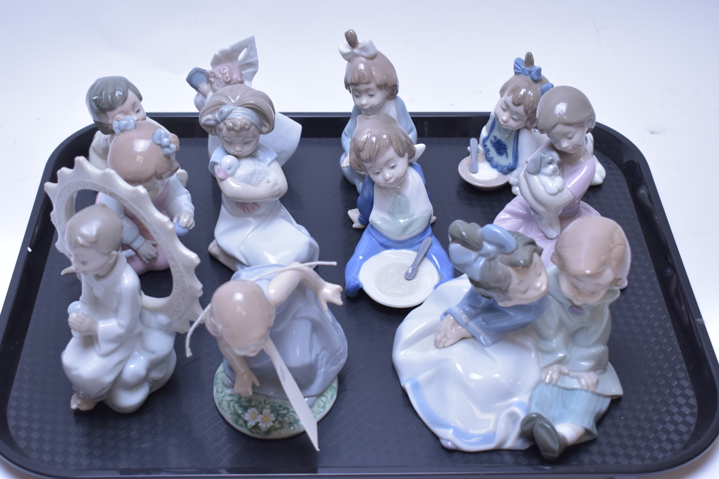Lot 213 Eleven Nao figurines.