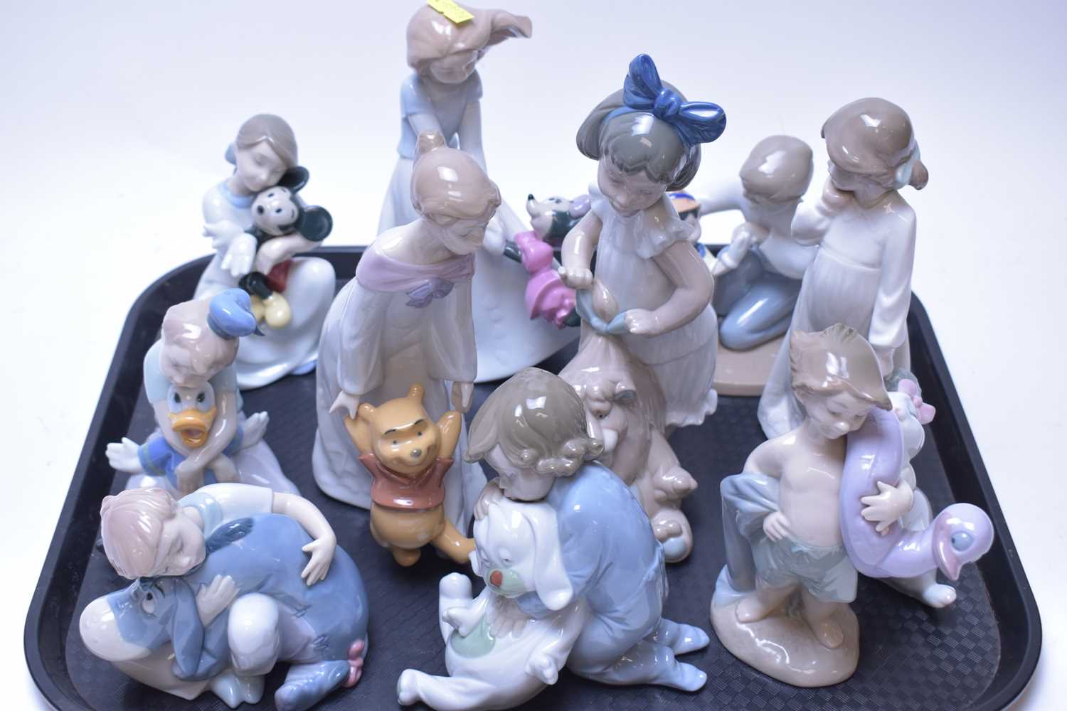 Lot 225 - Eleven various Nao Disney Collection figurines.