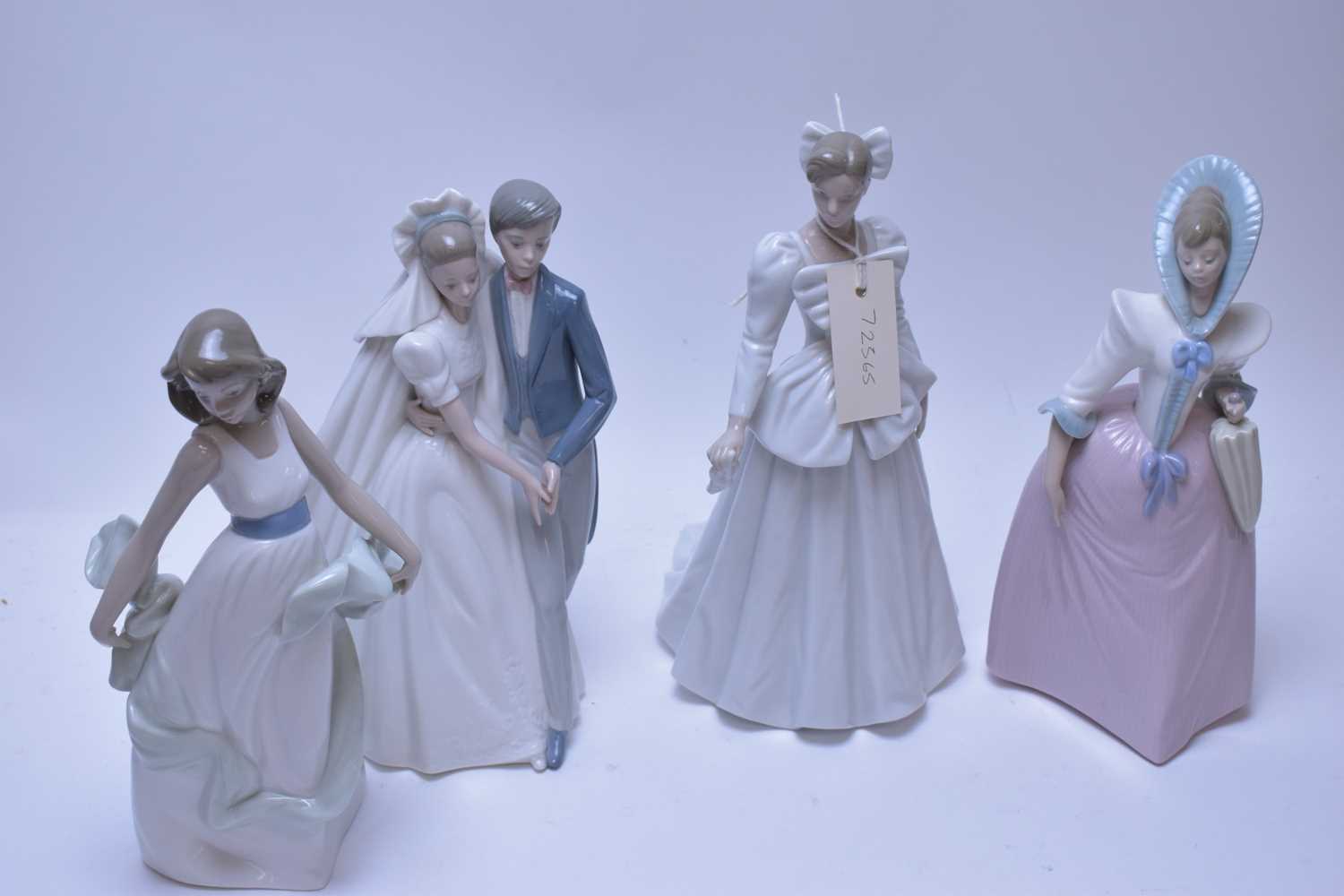Lot 232 - Four Nao figurines.