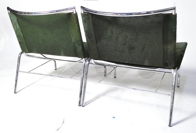 Lot 46 - A pair of designer low slung chairs.