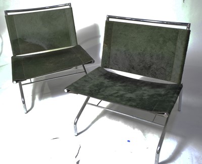 Lot 46 - A pair of designer low slung chairs.
