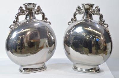 Lot 34 - Pair of silvered vases; and a pair of silvered ball ornaments.