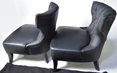 Lot 48 - A pair of designer faux black leather easy chairs.