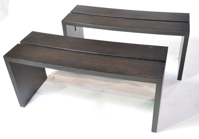 Lot 52 - A pair of designer ebonised benches.