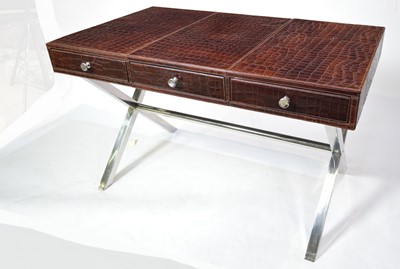 Lot 53 - Attributed to Andrew Martin: a faux crocodile skin and chromed metal desk.