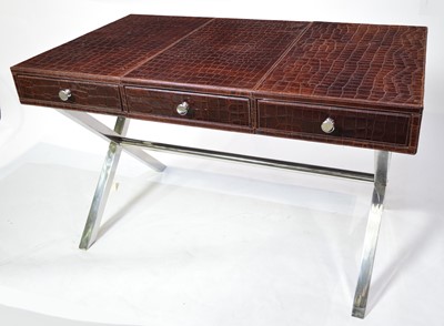 Lot 53 - Attributed to Andrew Martin: a faux crocodile skin and chromed metal desk.