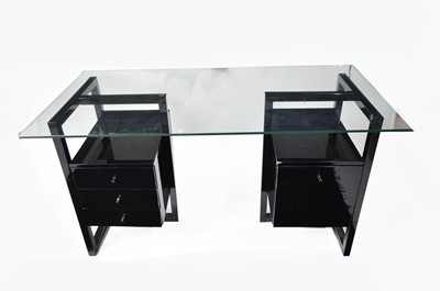 Lot 57 - A modern black lacquered and glass desk.
