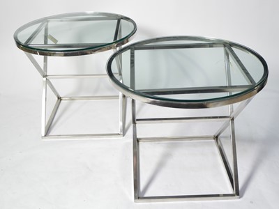 Lot 58 - Manner of Eichholtz: a pair of chromed metal occasional tables.