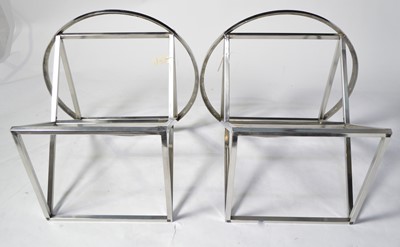 Lot 58 - Manner of Eichholtz: a pair of chromed metal occasional tables.