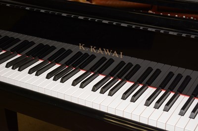 Lot 744 - K. Kawai black lacquered baby grand piano and stool.