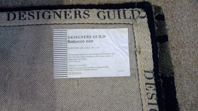 Lot 39 - Designers Guild: a 'Nabucco Noir' carpet.
