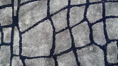 Lot 39 - Designers Guild: a 'Nabucco Noir' carpet.