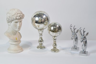 Lot 36 - Two globe-style ornaments; two stag's head ornaments; and a bust ornament.