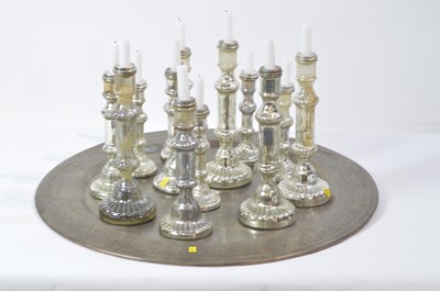 Lot 35 - Twelve assorted candlesticks on Indian style tray.