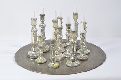 Lot 35 - Twelve assorted candlesticks on Indian style tray.