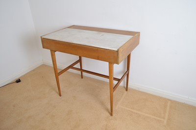 Lot 131 - A mid 20th Century side table/desk.
