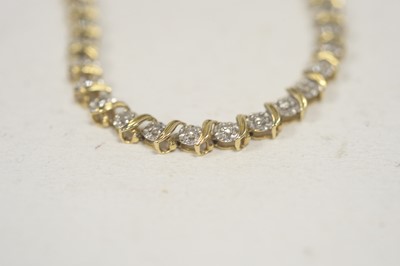 Lot 55 - A diamond tennis bracelet.