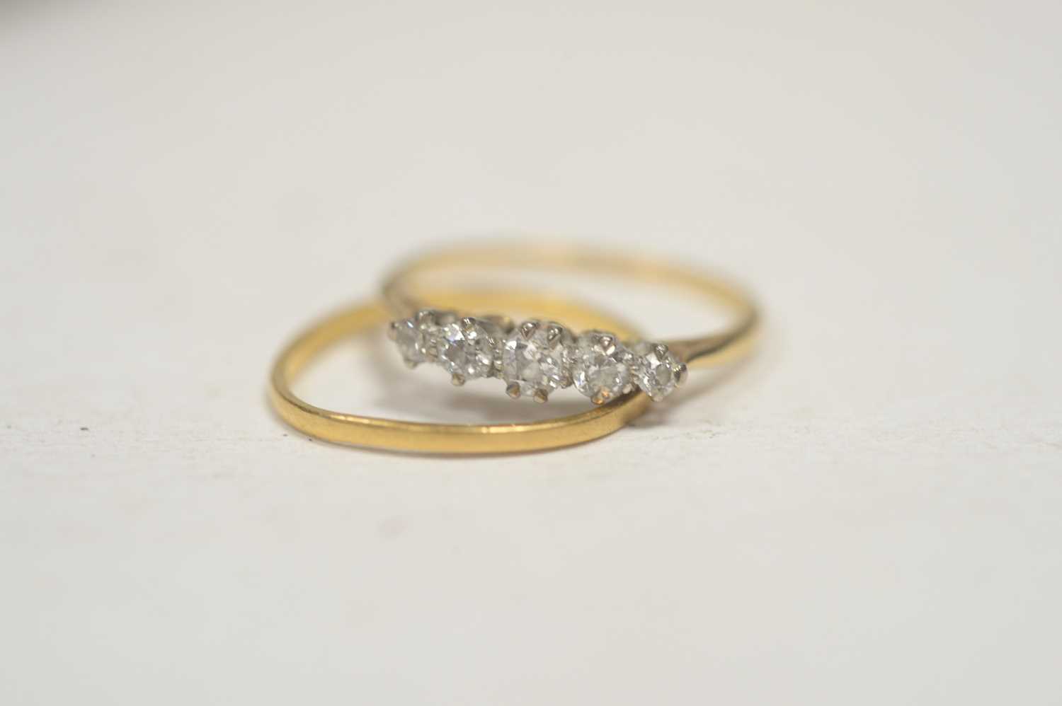 Lot 9 - A five stone diamond ring; and a wedding band.