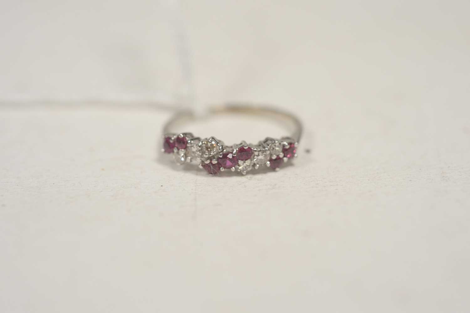 Lot 41 - A diamond and ruby ring.