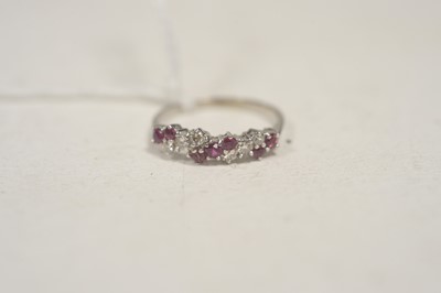 Lot 41 - A diamond and ruby ring.
