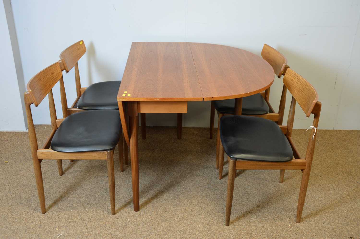 Lot 32 - G-Plan dining table and four chairs.