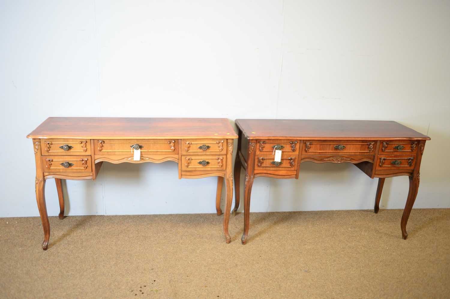 Lot 159 - A pair of modern walnut dressing tables/desks in the French taste