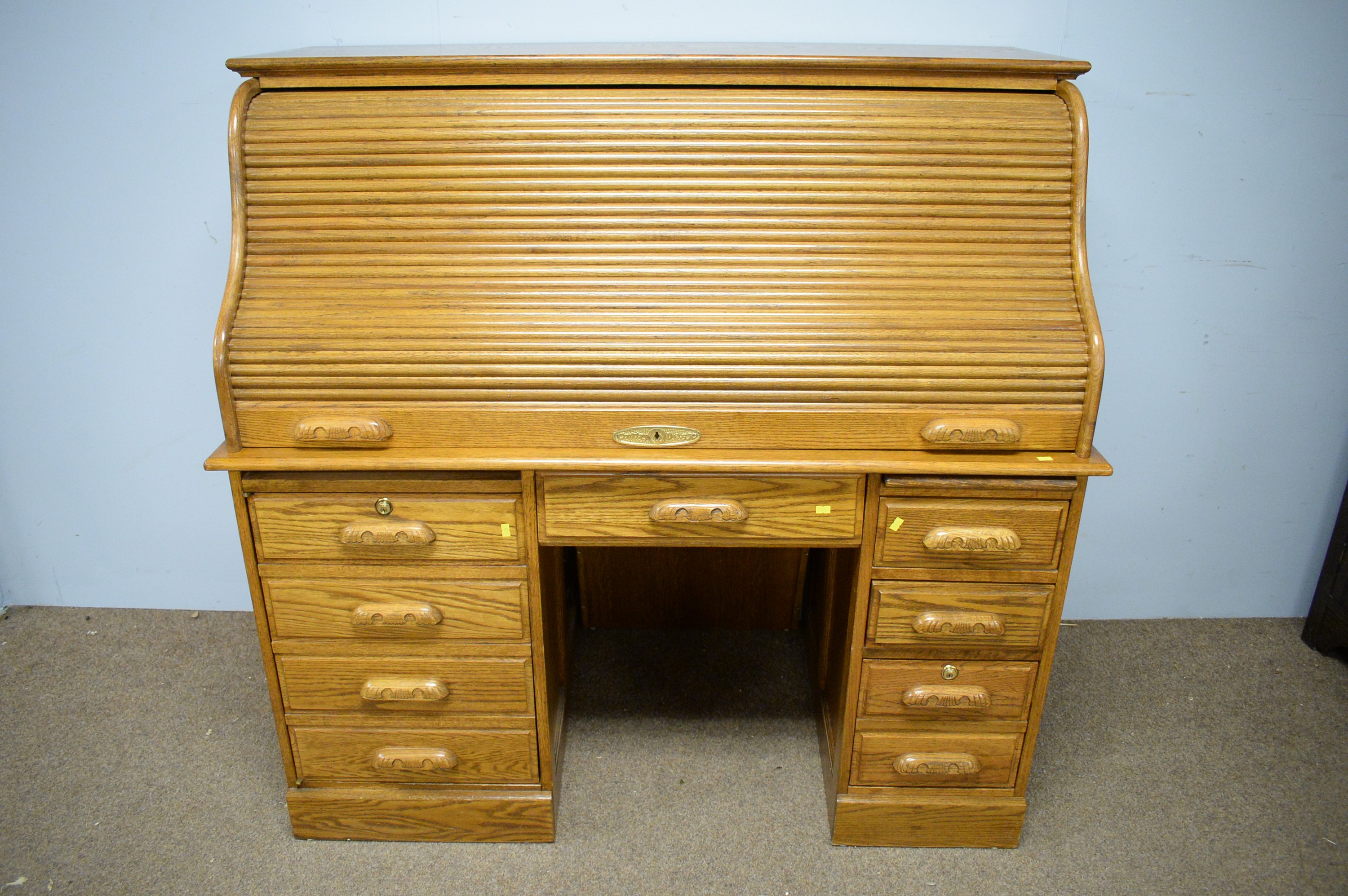 Lot 123 20th Century reproduction oak roll top desk
