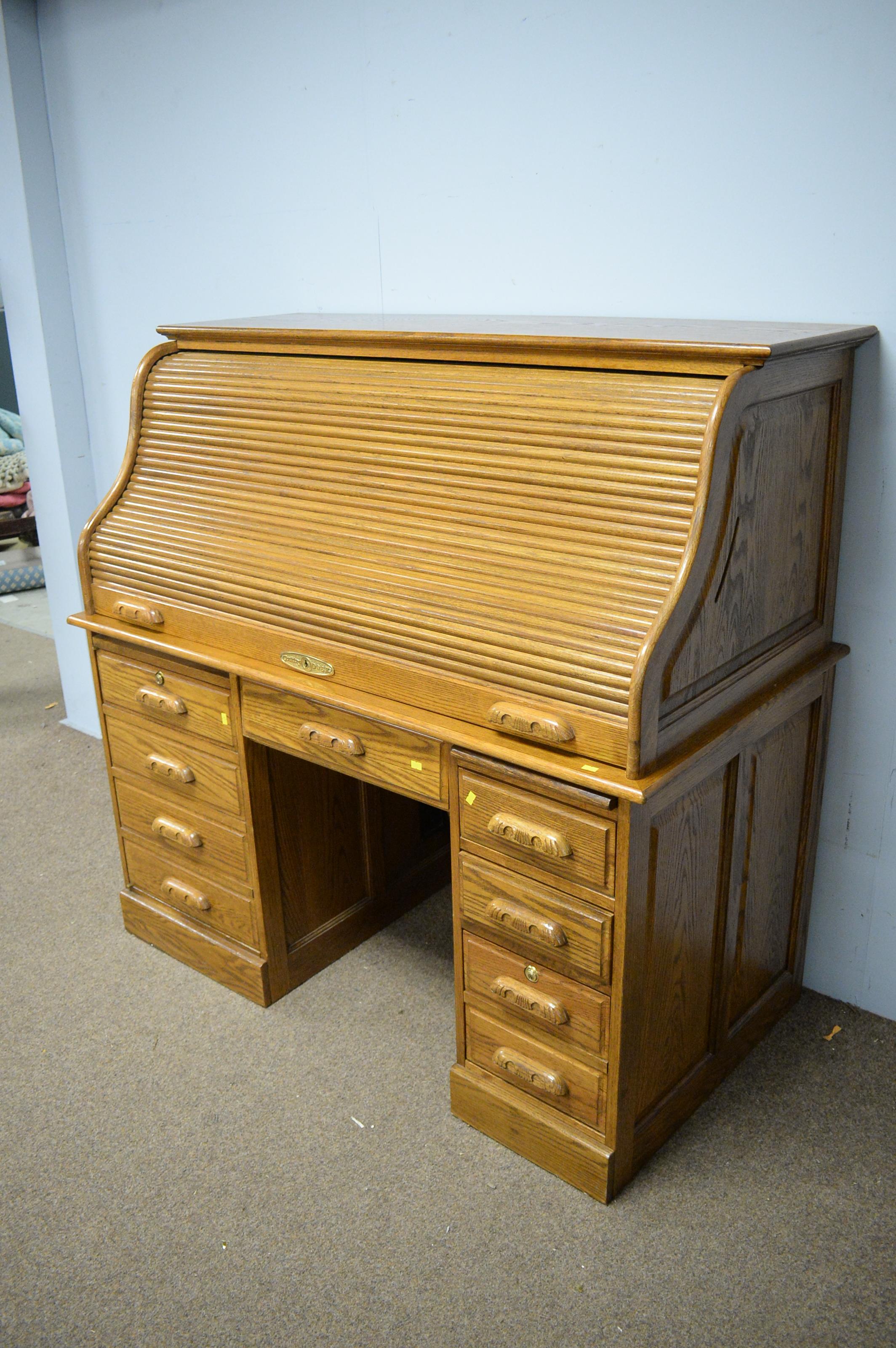 Lot 123 20th Century reproduction oak roll top desk
